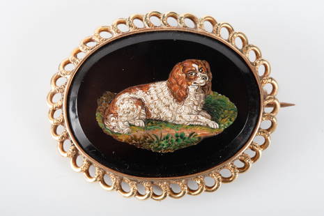 (19th c) ITALIAN MICRO MOSAIC & GOLD BROOCH: Depicting a King Charles spaniel set into a looped gold bezel. 1 3/4 x 2 1/4 inches.