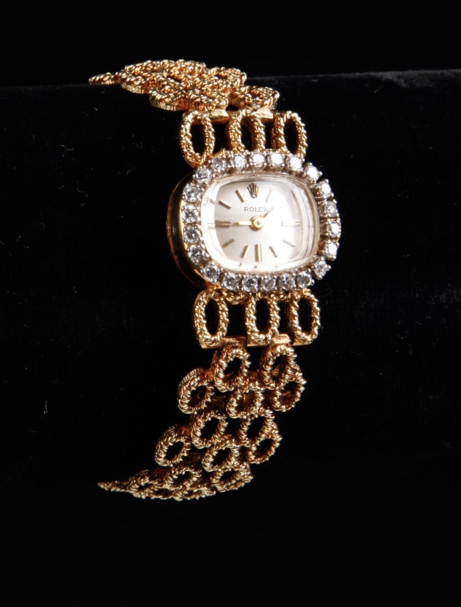 WOMAN'S 14k GOLD and DIAMOND ROLEX WRISTWATCH: Ladies Rolex 1700 14k yellow gold & diamond 17 jewel watch 1/2 x 3/4 inch bezel. 21.5 DWT