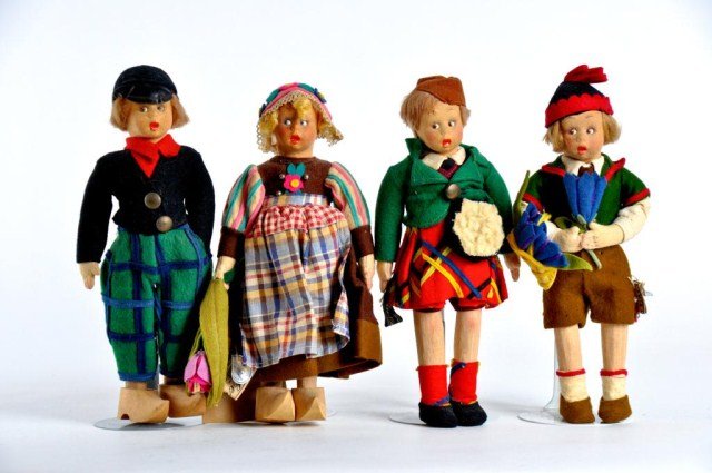 Lot of four Lenci Mascottes: (1) 9" Holland girl with script and cloth tag, and hand written provenance, indicating it was a birthday gift in 1939, with detailed felt dress & hat, printed cotton apron and wooden Dutch shoes (1) 9