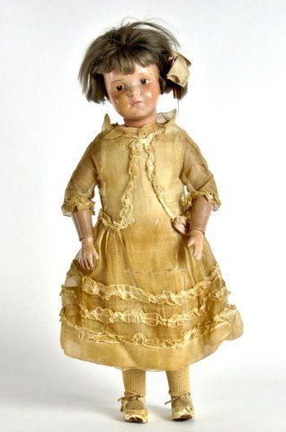 18" Schoenhut Pouty girl doll,: incised "Schoenhut Doll Pat. Jan 17 11' USA & Foreign Countries" with wooden head, brown intaglio eyes and spring jointed wooden body in original clothing with wig, still nailed on