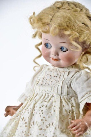 11 1/2" Armand Marseille Bisque socket head,: "Googly Eye Doll", incised "Germany 323 A 3/0 M" with blue paperweight eyes, single stroke brows, feathered lashes, and five piece composistion body with bent arms
