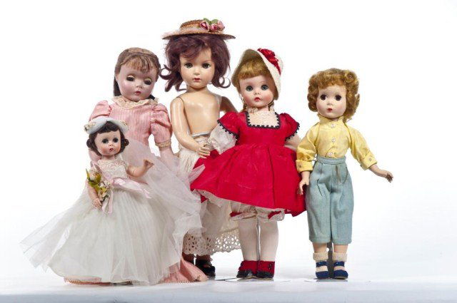 Lot of five Madame Alexander dolls: (1) 12" Lissy Bride with head off (1) 14" Madame Alexander vinyl doll wearing pants, yellow button down shirt, socks, shoes (1) 17" hard plastic Little Women type Madame Alexander wearing peach dress