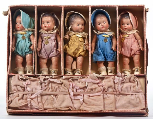 Madame Alexander Dionne Quintuplets: in original box, 5-8" composition dolls dressed in rompers and caps, all with original tags, and extra pink p.js.