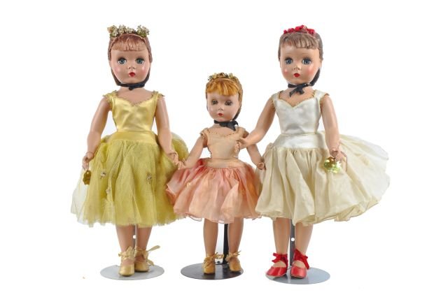 (3) hard plastic Margot Ballerinas - 17 inch-: white dress, gold wrist tag, rose headband - 17 inch in gold dress, wrist tag, headband - 14 inch in pink tutu, fading and spots on face - heavier soil , clothing faded.