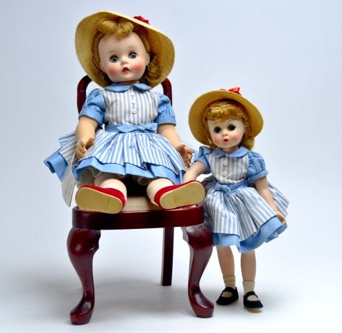Madame Alexander 15" Kelly - blue stripped dress: - earrings( green ear), straw hat with red bow, white socks, red shoes -clothes have light soil - doll has staining around waist - original tag - 11" Kelly - heart earrings , blue striped dress , stra