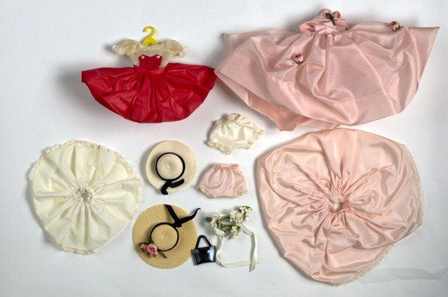 Lot of (2) Madame Alexander "Cissette" outfits,: (1)#810 red & white dress with slip, panties, handbag & bonnet tagged, (1) boxed "Lady Hamilton" #975 outfit untagged , pink silk gown, matching slip, panties & bonnet with black velvet sash & pink fl