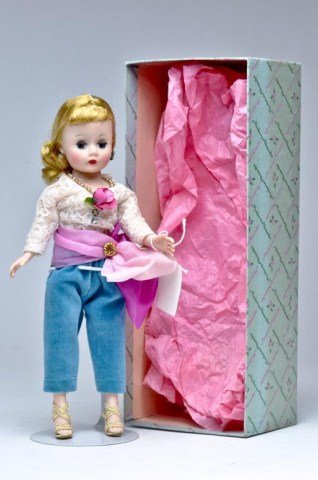 Madame Alexander "Cissette" ca. 1958, blonde: with triple stitch wig in tagged outfit, turquoise velveteen pants, lace top with flower embellishment, wears rhinestone earrings , faux pearl necklace, pink & fuschia tulle bow accents waist, gold br