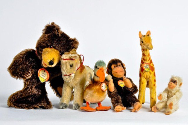 Group of six Steiff animals consisting of a teddy: bear hand puppet, horse , giraffe, duck and two monkeys