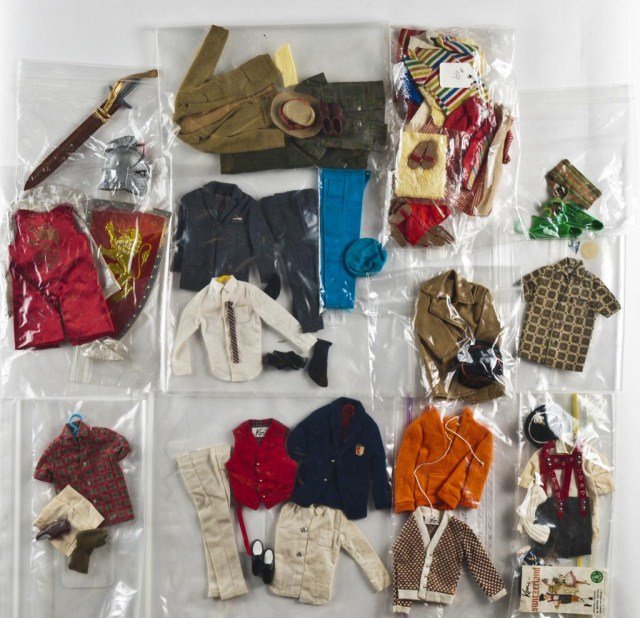Lot of Ken fashions - bag of swimsuits,: towels, shorts & sandals(some damage/soil) snorkel gear, orange sweat shirt & sweater, Ken in Switzerland(missing pipe- soil on shirt) Victory Dance(complete - soil to shirt & pants) Campus Hero, Casu