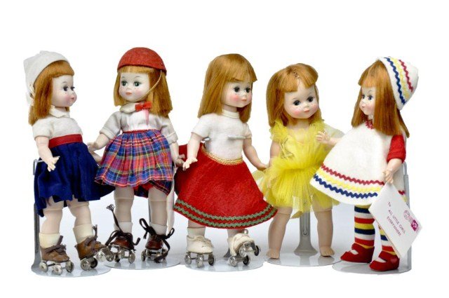 Lot of (5) 8" Maggie Mixups, (1) red/white blue: dress with sweater top & roller skates, (1) skater with scotch plaid , (1) skater with red felt skirt outfit, (1) Ballerina & (1) white felt romper & red , yellow and blue ric-rac trim - retains wrist