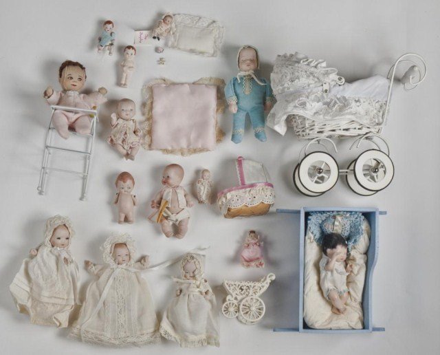 Lot newer porcelain dolls, baby dolls and: Bye Lo type dolls in carriages plus doll in cradle. Doll sizes range from about 6" down to about 2".