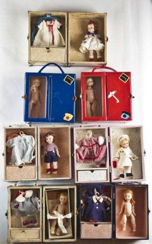 Lot of seven Madam Alexander: trunks/suitcases, including dolls and wardrobe sets.