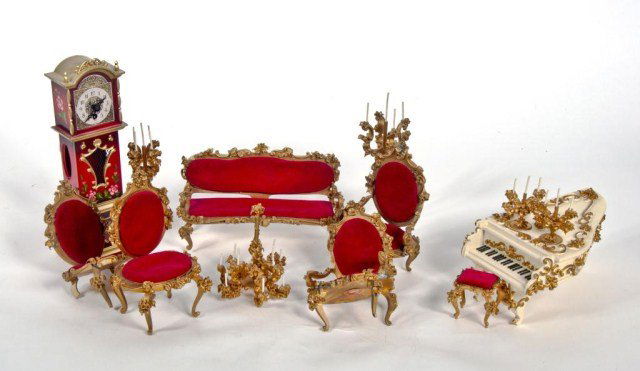 Lot of Spielwaren ornate victorian furniture -: velvet covered sttee- ( 5"tall x 8 1/2" long - some loss to gold paint ), tall clock (10"tall) , piano, arm chairs (one has broken legs & arms - some pieces are present), tall candlestick, pr. small a