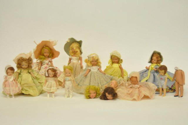 Lot of misc. Nancy Ann dolls - untagged ,: missing arms, etc., along with Nancy Ann collectors book, Muffie with stand 7 1/4", 14 Story Book dolls - various conditions, bag loose Nancy Ann clothes