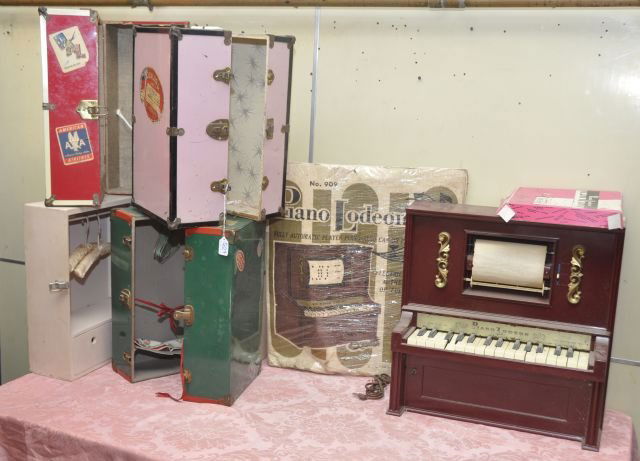 Lot of four doll steamer trunks: together with a "Piano Lodeon" and box of rolls. Trunks appox 18"h