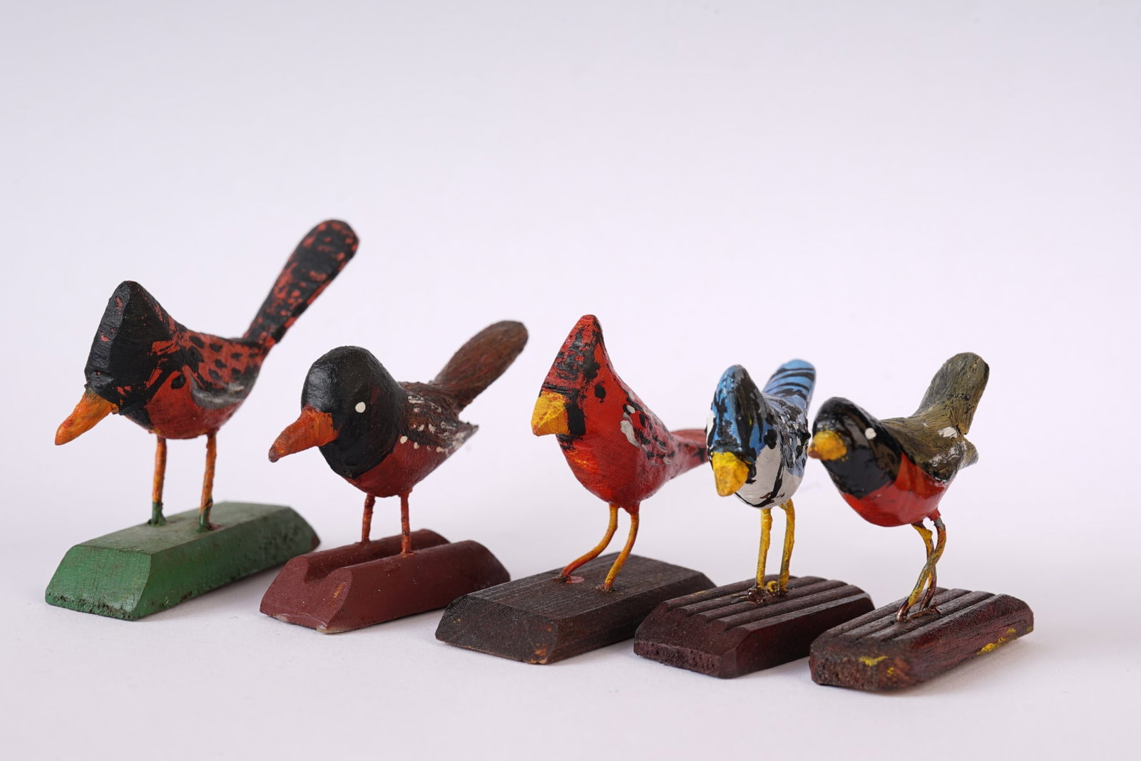 (5) VINTAGE MINIATURE CARVED BIRDS: Hand-carved and painted wood birds, mounted on stands, 1 1/2 inches overall.