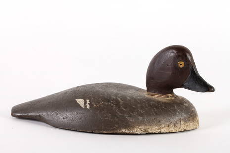 GOLDEN EYE HEN DECOY: Carved and painted decoy, by Bob Kerr, Smith Falls, Ontario. 12 inches long.