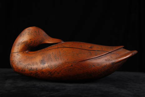 PREENING DUCK DECOY: Carved wood in natural finish. 15 1/2 inches long.