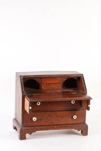 ANTIQUE MINIATURE CHIPPENDALE DESK: Slant-lid desk with 2 graduated drawers, interior with 2 drawers and 2 cubby holes; slant lid is supported by pull-out rails. All early dovetailed construction, including the 2 interior drawers. Sets
