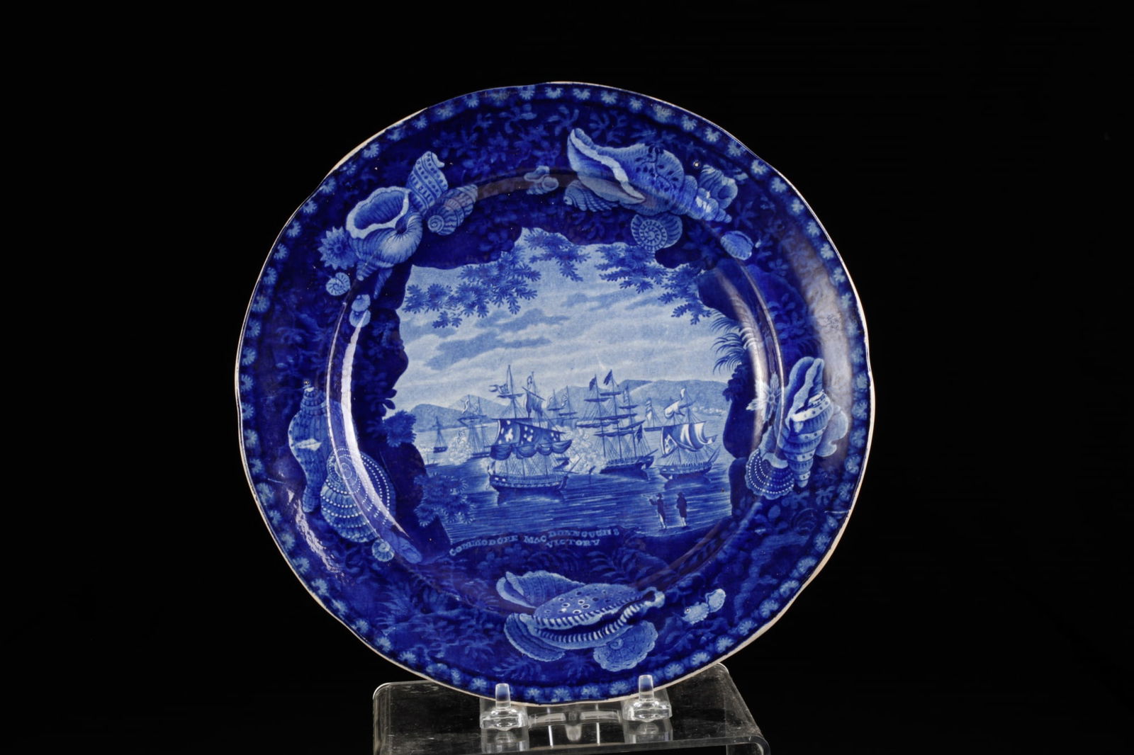 "COMMODORE MACDONNOUGH'S VICTORY" PLATE: Blue and white historical Staffordshire plate, commemorating the June 1814 Naval Battle of Lake Champlain. 10 inch dia