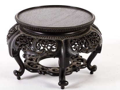 SMALL CARVED CHINESE STAND: Finely-carved black stand 7 inches dia. x 4 1/2 inches high.
