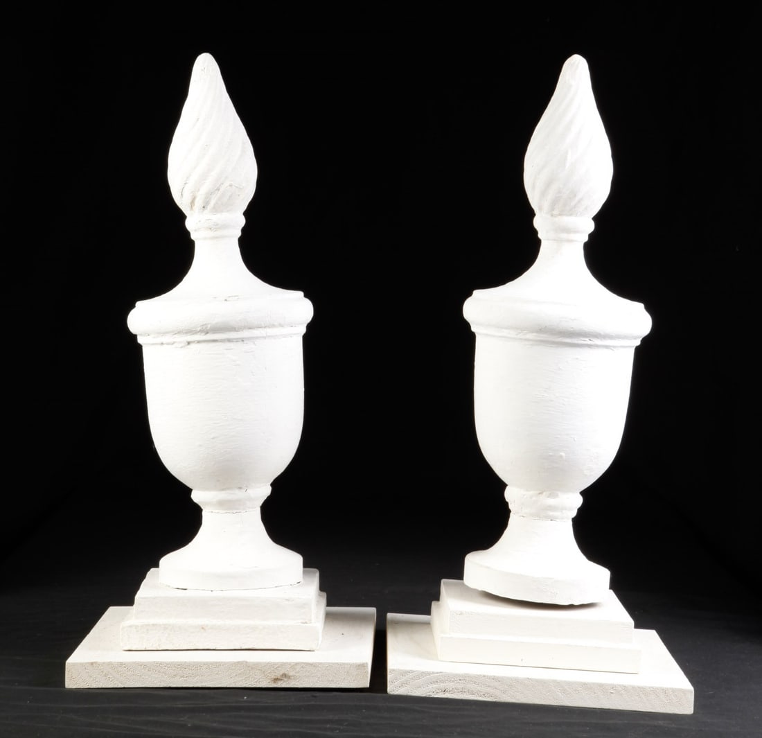 PAIR OF WHITE CARVED WOOD FINIALS: With flame top, mounted on stepped square base, 20 inches tall. Early 20th c.