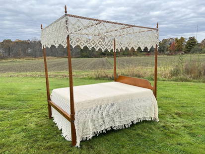 ELDRED WHEELER TIGER MAPLE CANOPY BED: Full-size bed. Height 87 12inches. Eldred Wheeler brand and paper label on back of headboard. Massachusetts 20th c.. Together with needlework canopy, spread, box spring and mattress if wanted