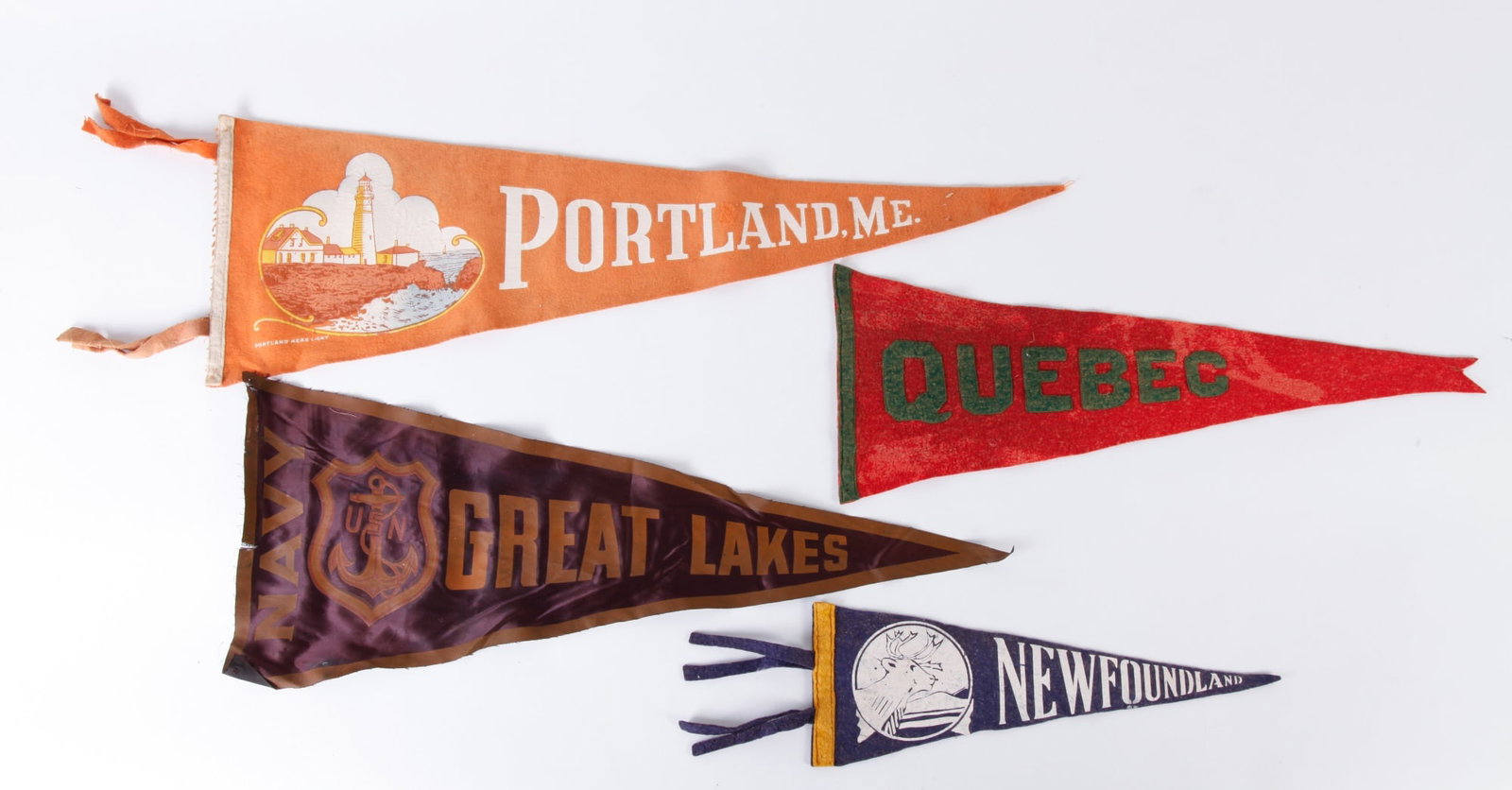(5) PENNANTS: "NAVY GREAT LAKES", "PORTLAND, ME","QUEBEC", "PORTSMOUTH, NH" and "New Foundland". Largest is 29 inches.