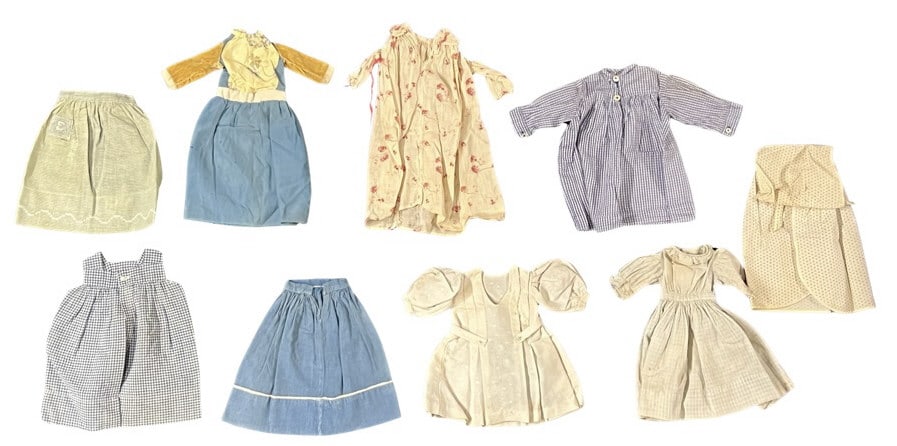 (8) PIECES OF VINTAGE DOLL CLOTHING: INCLUDING AN EARLY COTTON CHECK DRESS, blue gingham dress, blue & white pinafore, homemade French cotton dress (1920s), etc. See pics for more info.