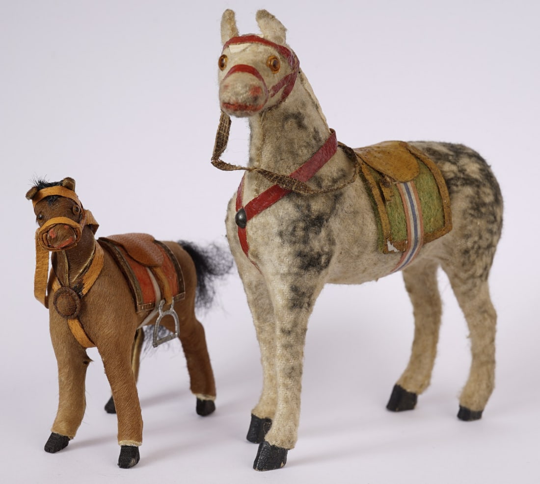 (2) VINTAGE TOY MINIATURES of HORSES: One appears to be a felt outside covering, the other a hide. Talles 4 inches high, 3 1/2 inches long.