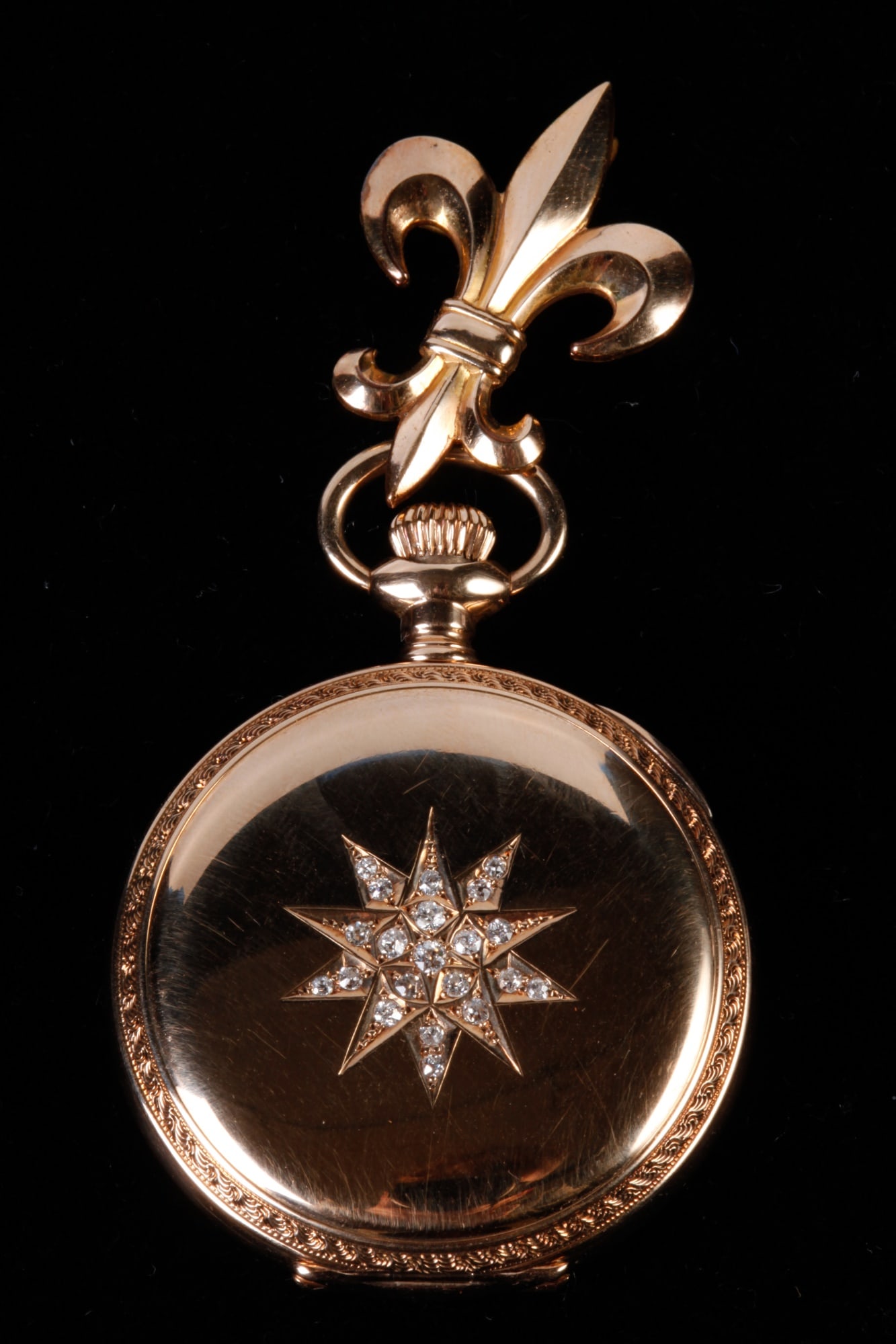 AMERICAN WALTHAM 14k GOLD LADY'S POCKET WATCH: 1 1/4 inch dial with second hand. Case #35510 engraved with a star set with diamonds. Riverside Safety Barrel movement marked #6031169. 40 dwt. (not including Fleur-de-lis pin not original to the watc