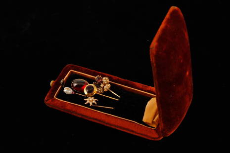 (5) DELICATE STICKPINS: Including: 14k gold set with cabochon cut garnet, unmarked freshwater pearl and pink gemstone, flower with seed pearls and amethysts, 14k gold star with seed pearls and a 10k gold example set with a c