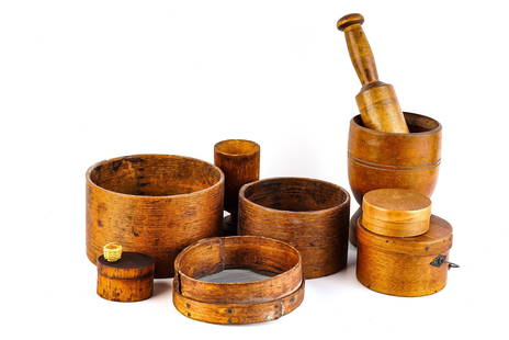 GROUP OF NEW ENGLAND COUNTRY PRIMITIVE TREENWARE: Including: Mortar and pestle, swing handle pantry box, other pantry boxes, measure, sieve etc 9 3/4 inches (and under)