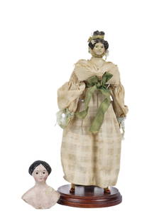 QUEEN ANNE DOLL & HEAD and SHOULDER PLATE: Queen Anne doll with hand painted ceramic head/shoulder plate, yellow ribbon tied in her hair, linen dress and a painted paper mache head and shoulder plate. 7 1/2 inches (and smaller)