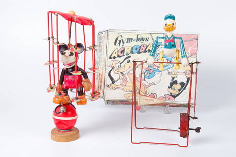 MARX DONALD DUCK GYM-TOY & MICKEY MOUSE WIND-UP: Walt Disney's Donald Duck Acrobat and Pre-War Japanese Celluloid Mickey Mouse whirligig wind-up toy. 9 and 9 1/2 inches.