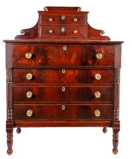 FANCIFUL STATE of MAINE SHERATON MAHOGANY DRESSER: Shaped back with brass roundels frame (2) cockbeaded drawers, over finely carved turned legs and (4) graduating drawers. 57 x 43 x 21 1/2 inches