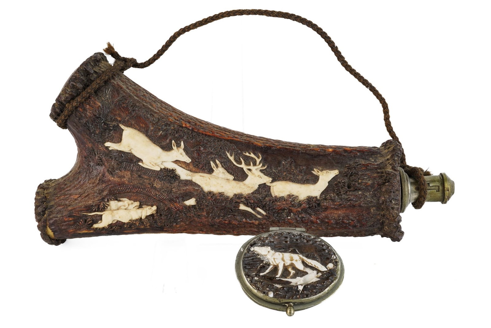 BLACK FOREST CARVED ANTLER POWDER FLASK: Carved with a fallen tree and inlaid in bone with a hunt scene of dogs chasing deer. 8 1/2 inches. Together with a porcelain faux horn hinged cap. 2 inches