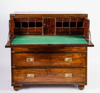 BRASS BOUND MAHOGANY FALL FRONT CAMPAGNE DESK: (1) Piece case of dovetail construction is raised on ball feet. Fall front opens to a writing surface, drawers and pigeon holes. 41 1/2 x 40 x 19 inches