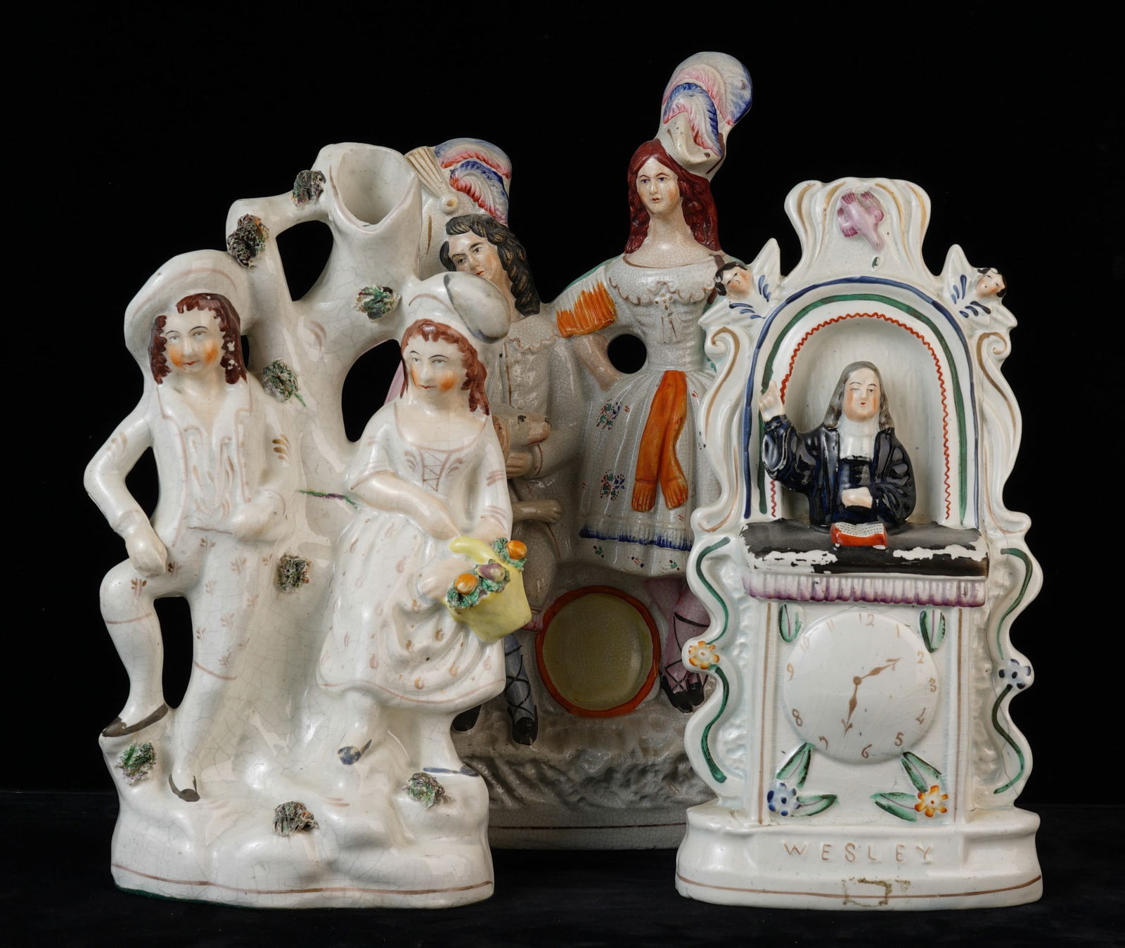 (3) STAFFORDSHIRE FIGURE GROUPS: Including: John Wesley, Scottish Couple with Dog and a Courting Couple with Trunk- Form vase. 13 1/4 inches. Provenance: Knox Mansion / Orchard House 800 Delaware Ave Buffalo, NY by direct descent. Th