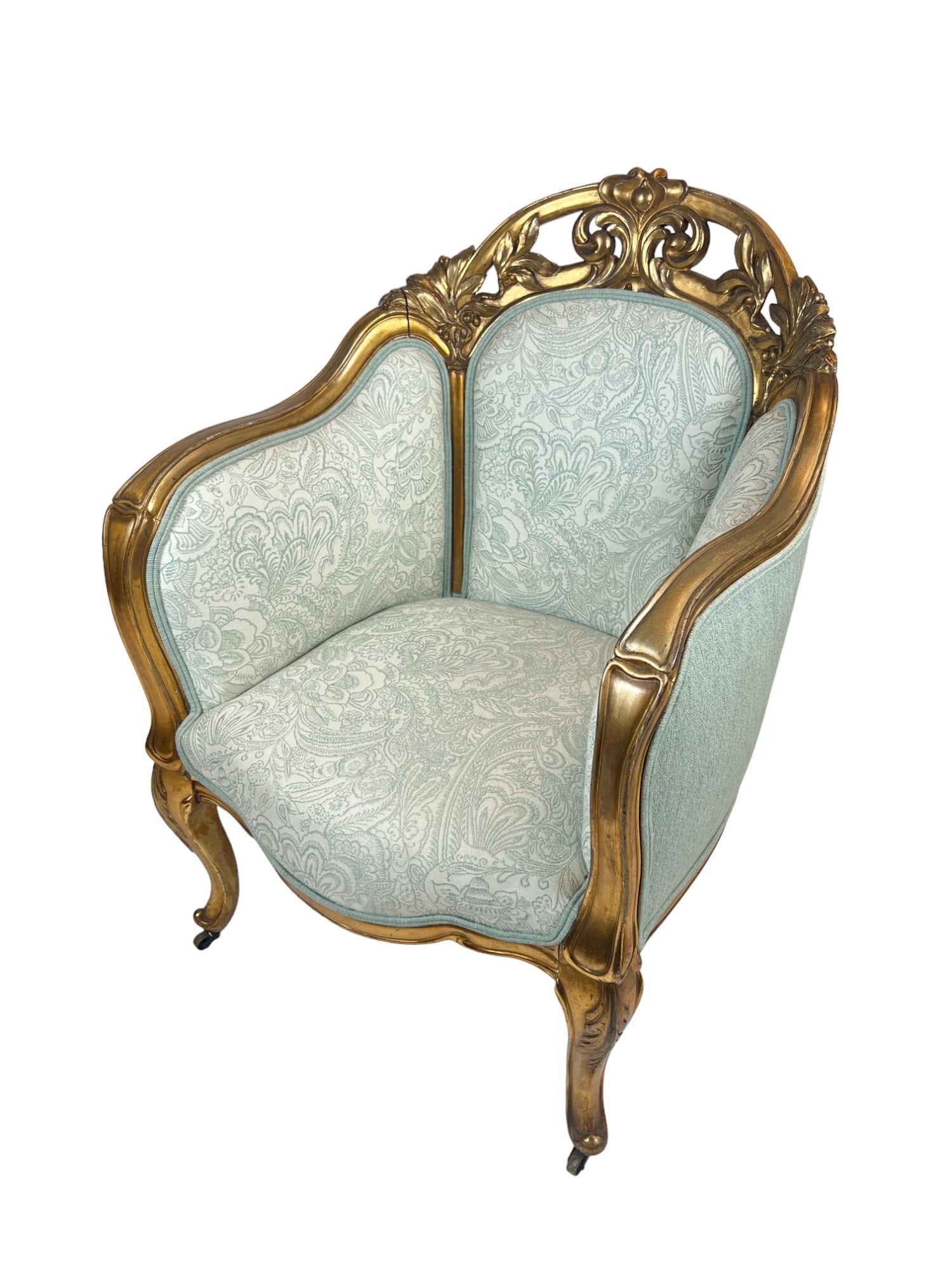 (19th c) LOUIS XV STYLE CARVED and GILT ARMCHAIR: Crest carved and pierced with acanthus leaves and leaf and berry motifs. 38 x 26 x 28 inches (including brass casters)