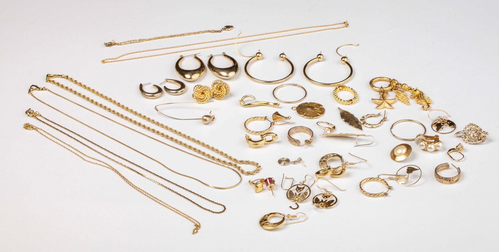LARGE GROUPING OF GOLD PLATED JEWELRY etc: Including: 17 inch gold chains, earrings, charms and fobs.
