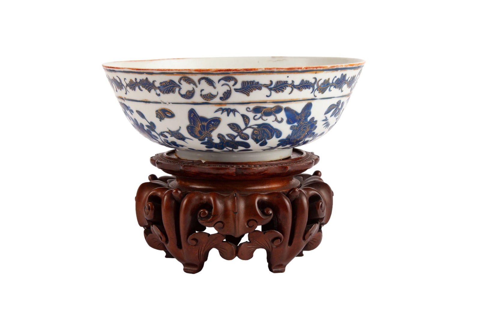 (19th c) CHINESE PORCELAIN BOWL: With blue enameled butterflies and birds accented with gilt. Together with carved wood stand. Diameter 8"