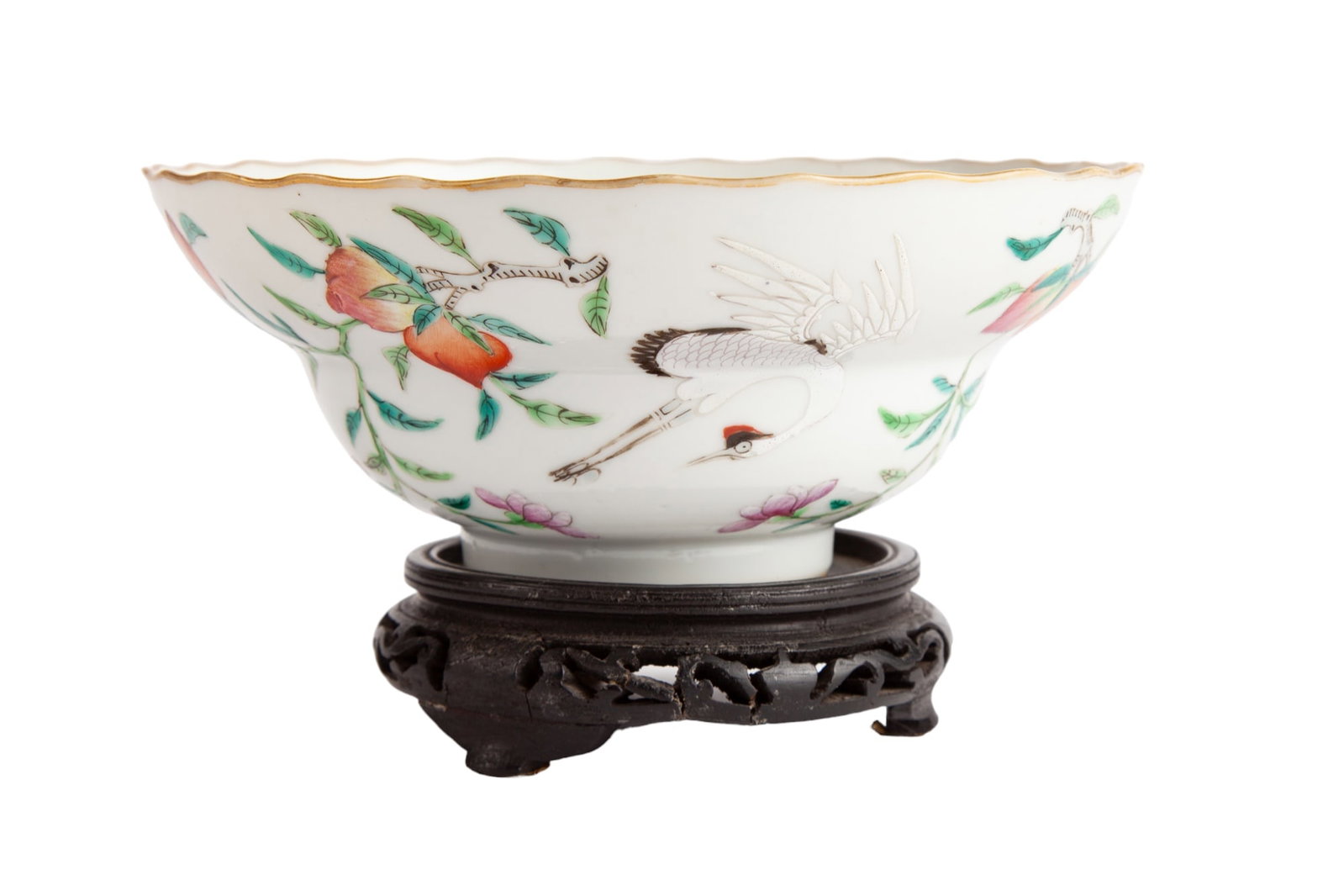 (Late 19th c) CHINESE PORCELAIN BOWL: Decorated with cranes and peaches around exterior. Together with wood stand. 6 1/2" in diameter