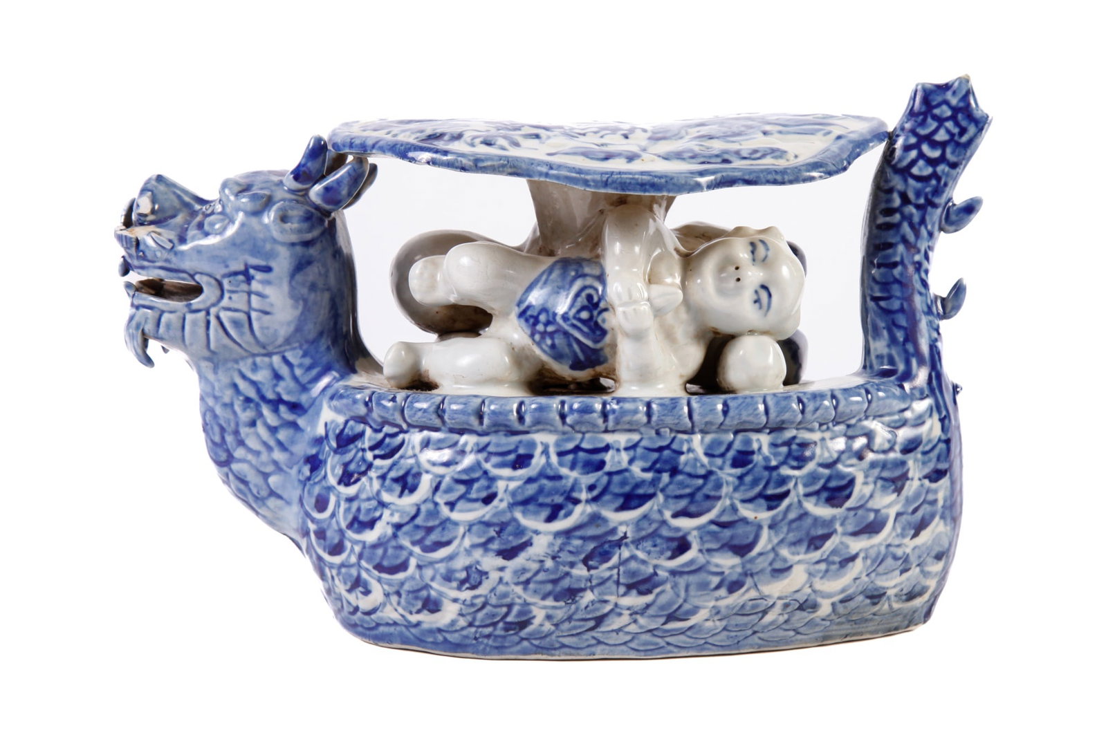 (19th c) CHINESE PORCELAIN PILLOW: Made in the form of a dragon boat. 9" long