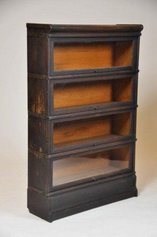 Four piece oak sectional bookcase: Four piece oak sectional bookcase. H: 52 1/4" W: 34"