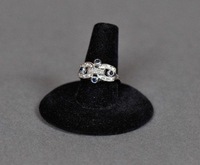18k white gold ring set with diamonds sapphires: 18k white gold ring set with diamonds and four small sapphires, size 5.5, DWT 2.8