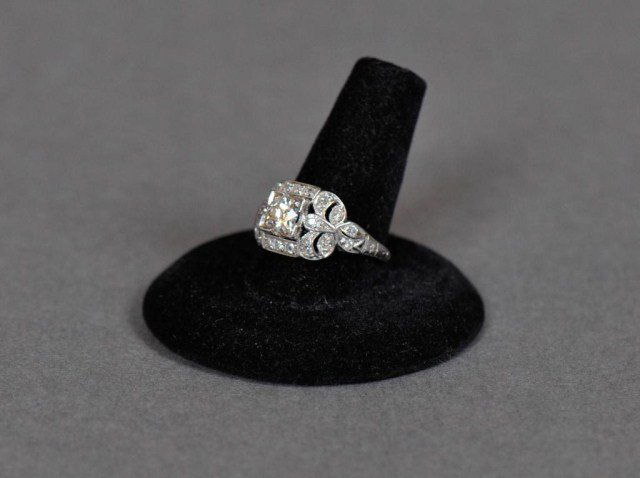 Antique platinum diamond ring: Antique platinum diamond mount set with old European cut round center diamond 5.4 mm x 3.1 mm, approx. .60 ct, H color, clean stone, approx. 1 ct twt, size 7, DWT 2.9