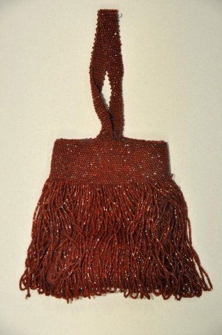 Lot of three antique beaded purses: Lot of three antique beaded purses, one large black with art deco frame,9" x 6 1/4", red flapper style, 6 1/4" x 4 1/4", one micro beaded colorful all over grape vine pattern 7 3/4" x 4 5/8"