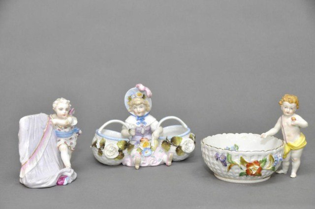 Lot of three Dresden style figurines: Lot of three Dresden style figurines two of children with baskets and one putti with crossed swords mark, largest 7" x 6 1/4"