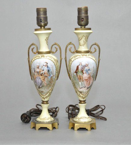 Pair of Dresden style lamps in yellow ground: Pair of Dresden style lamps in yellow ground with romantic scenes. H: 14 1/2"